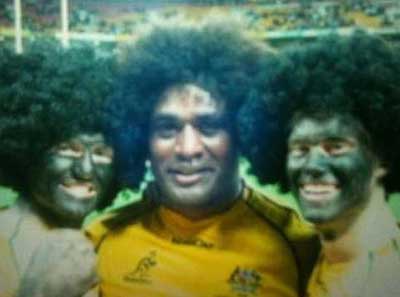Wallabies star Radike Samo with the two fans in blackface, who attended the game courtesy of Qantas.